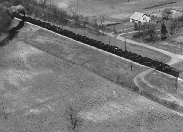 A long line of steam engines heads for scrapyard